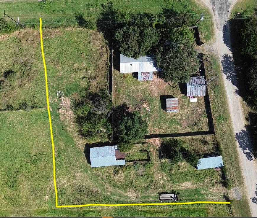 Aerial photograph of the lot with a yellow line drawn around the property boundary.
